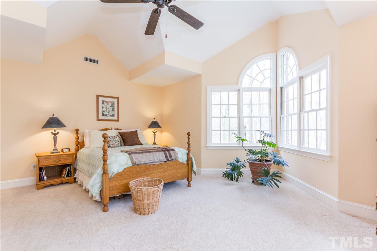 10616 Cahill Road Raleigh, NC 27614 - Photo 9 of 24 a bedroom with furniture and a large window