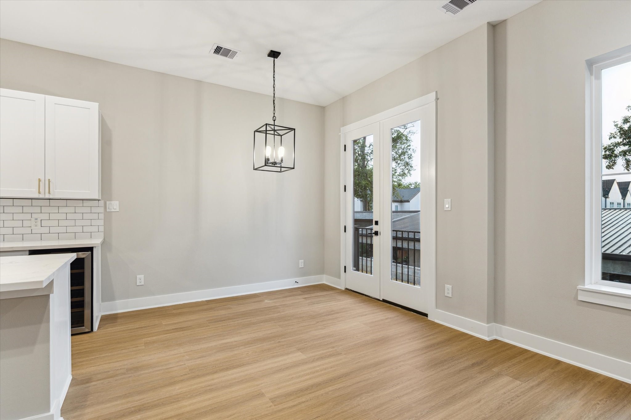 812 Thornton Road, Unit B Houston, TX 77018 - Photo 17 of 39 a view of an empty room with wooden floor and a window