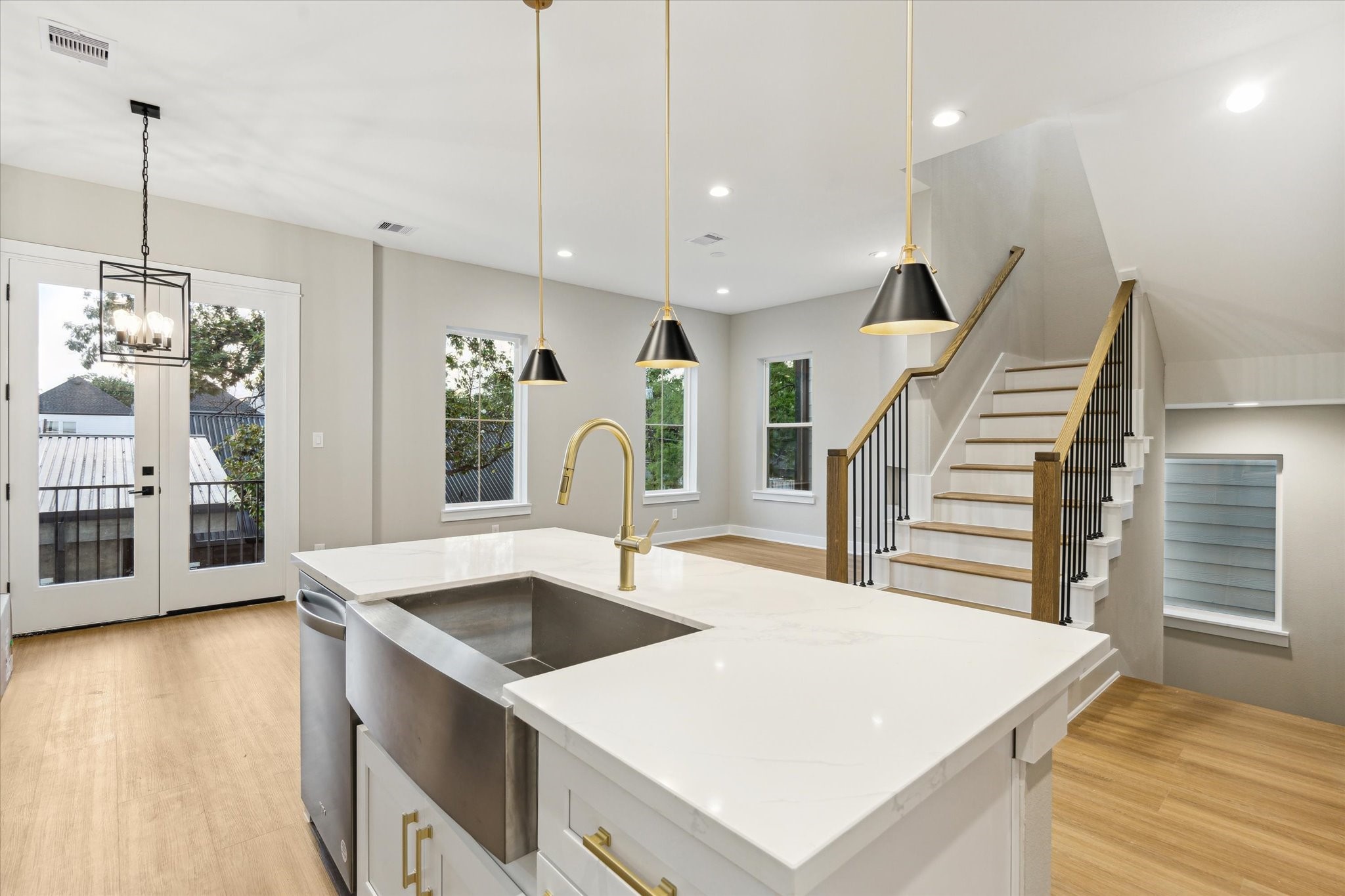 812 Thornton Road, Unit B Houston, TX 77018 - Photo 20 of 39 a large kitchen with stainless steel appliances kitchen island a large counter tops and a chandelier
