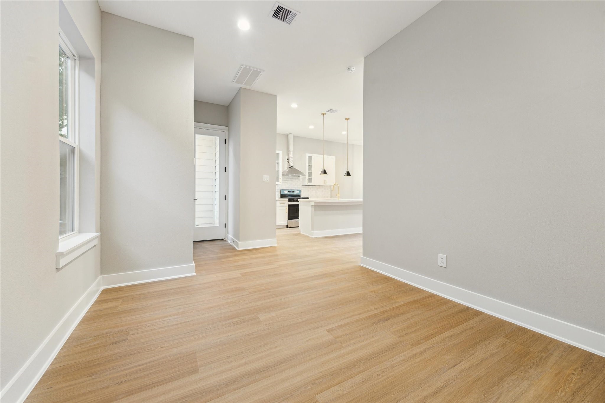 812 Thornton Road, Unit B Houston, TX 77018 - Photo 22 of 39 a view of a kitchen with wooden floor and a sink