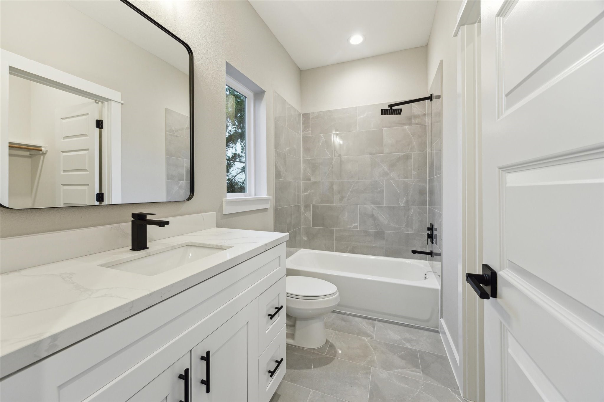 812 Thornton Road, Unit B Houston, TX 77018 - Photo 38 of 39 a bathroom with a sink a toilet and a large mirror
