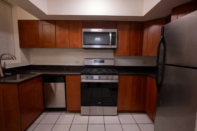 a kitchen with a stove and a microwave