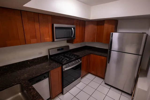 a kitchen with a stove microwave and refrigerator