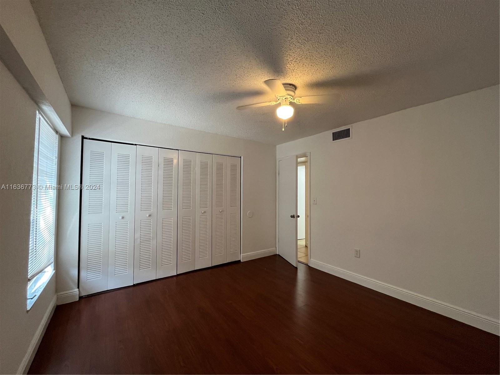 Hialeah Hialeah, FL 33012 - Photo 11 of 21 an empty room with a fan & a window