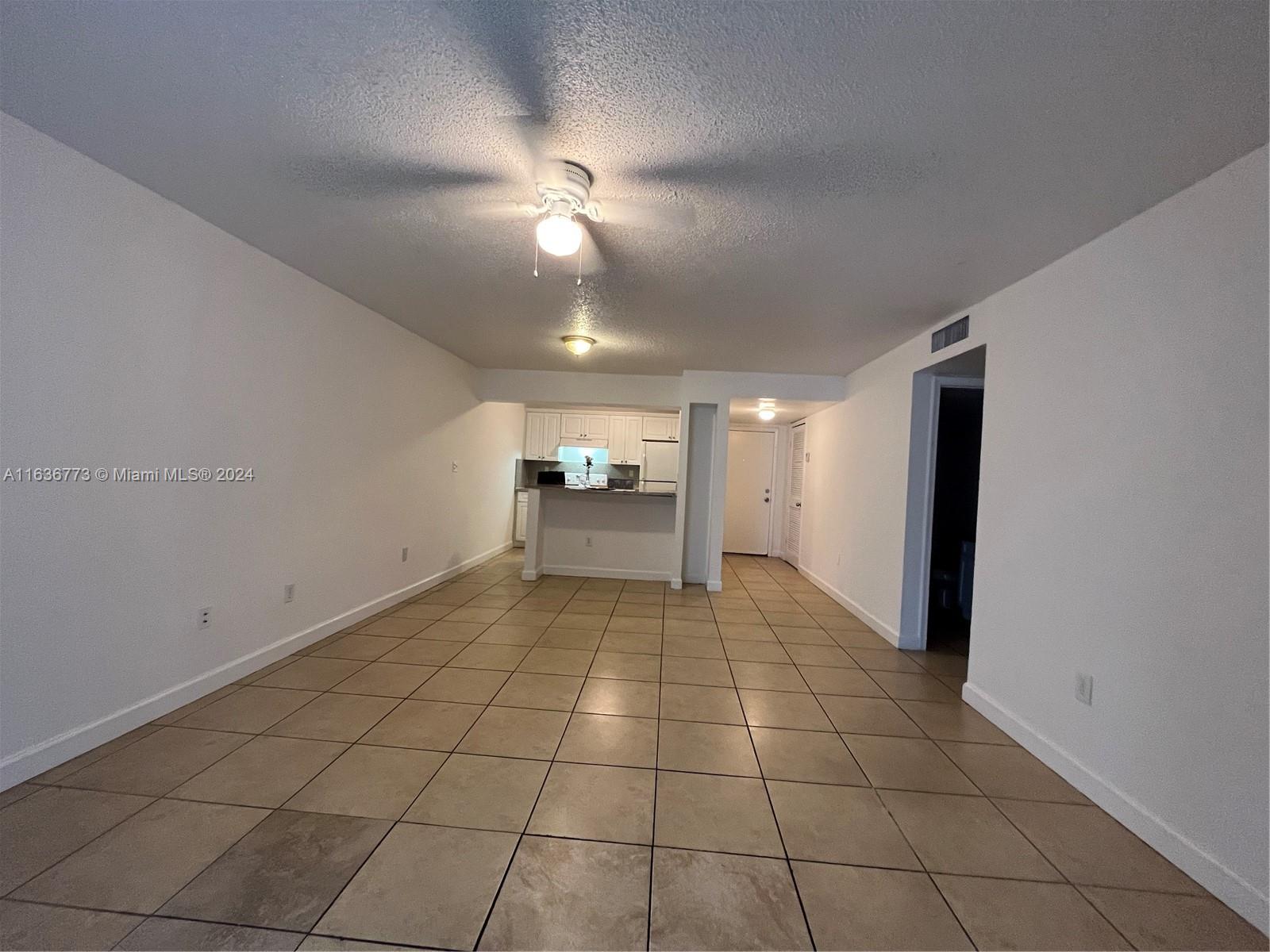 Hialeah Hialeah, FL 33012 - Photo 5 of 21 a view of an empty room and a chandelier fan