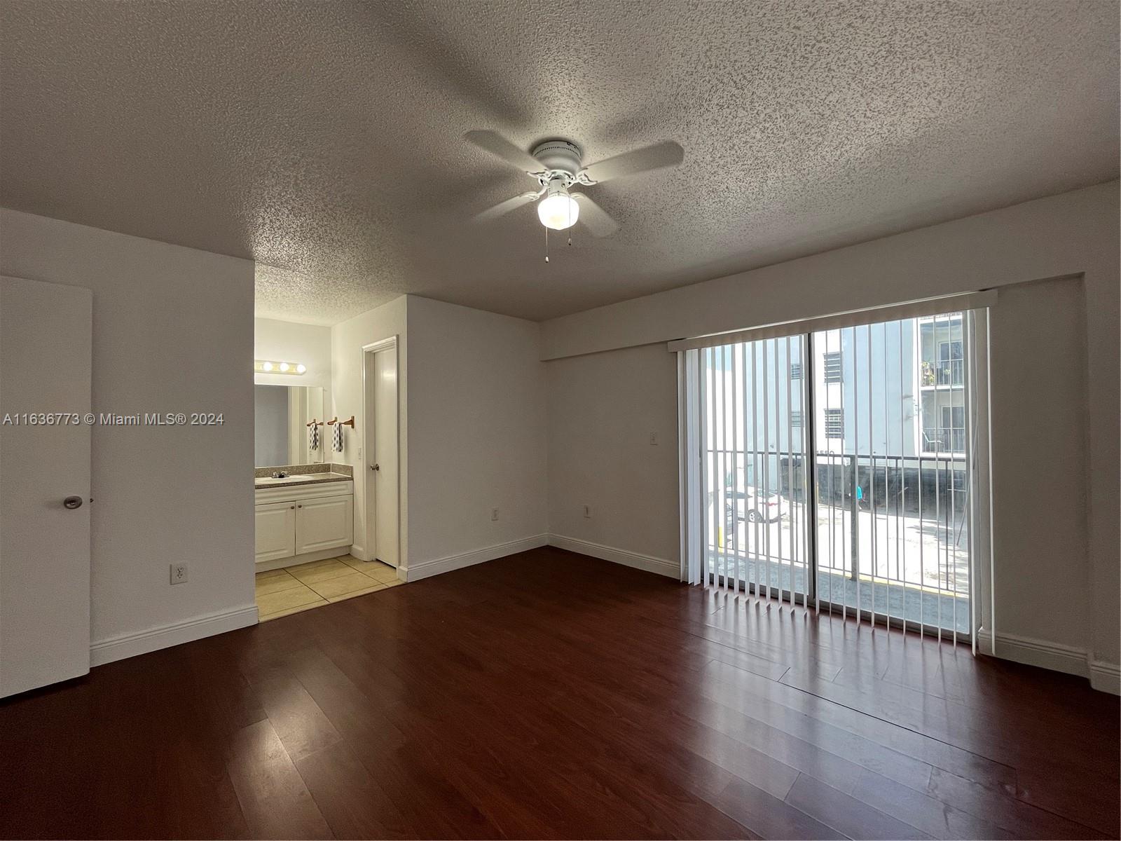 Hialeah Hialeah, FL 33012 - Photo 7 of 21 a view of empty room with wooden floor and fan
