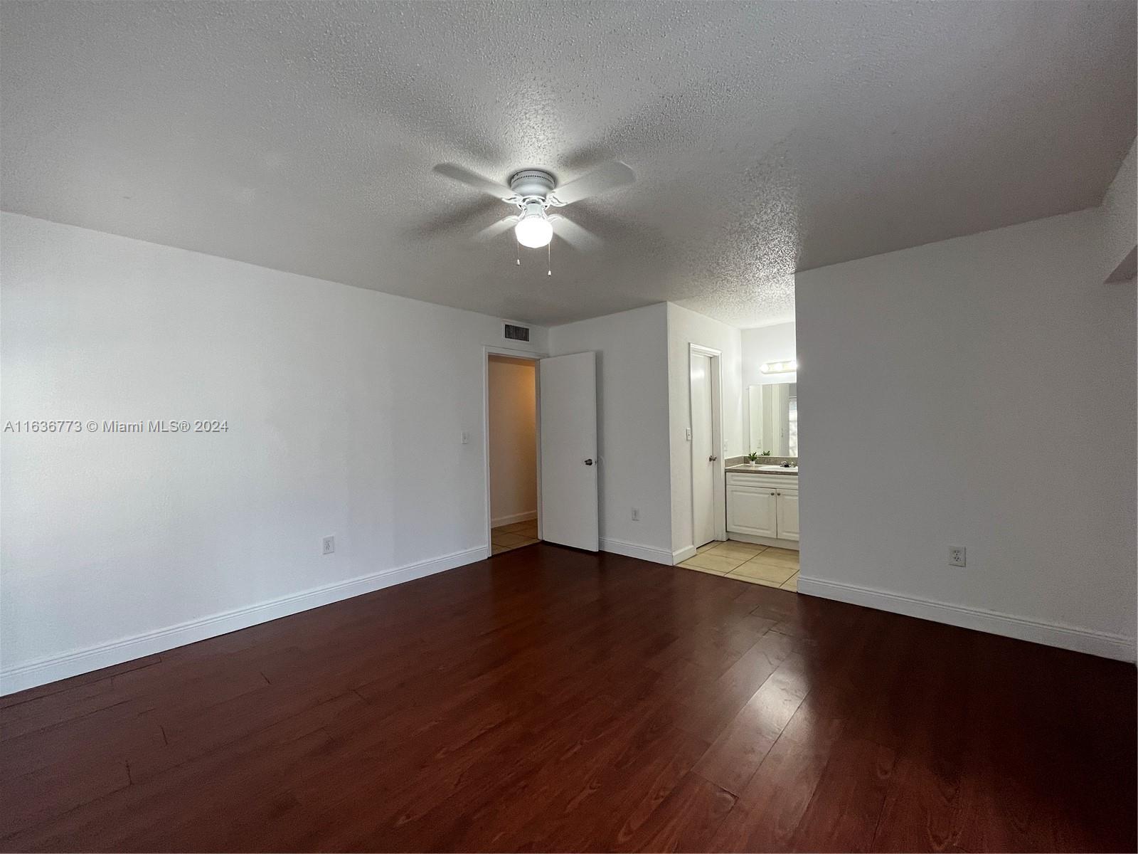 Hialeah Hialeah, FL 33012 - Photo 9 of 21 a view of an empty room with wooden floor