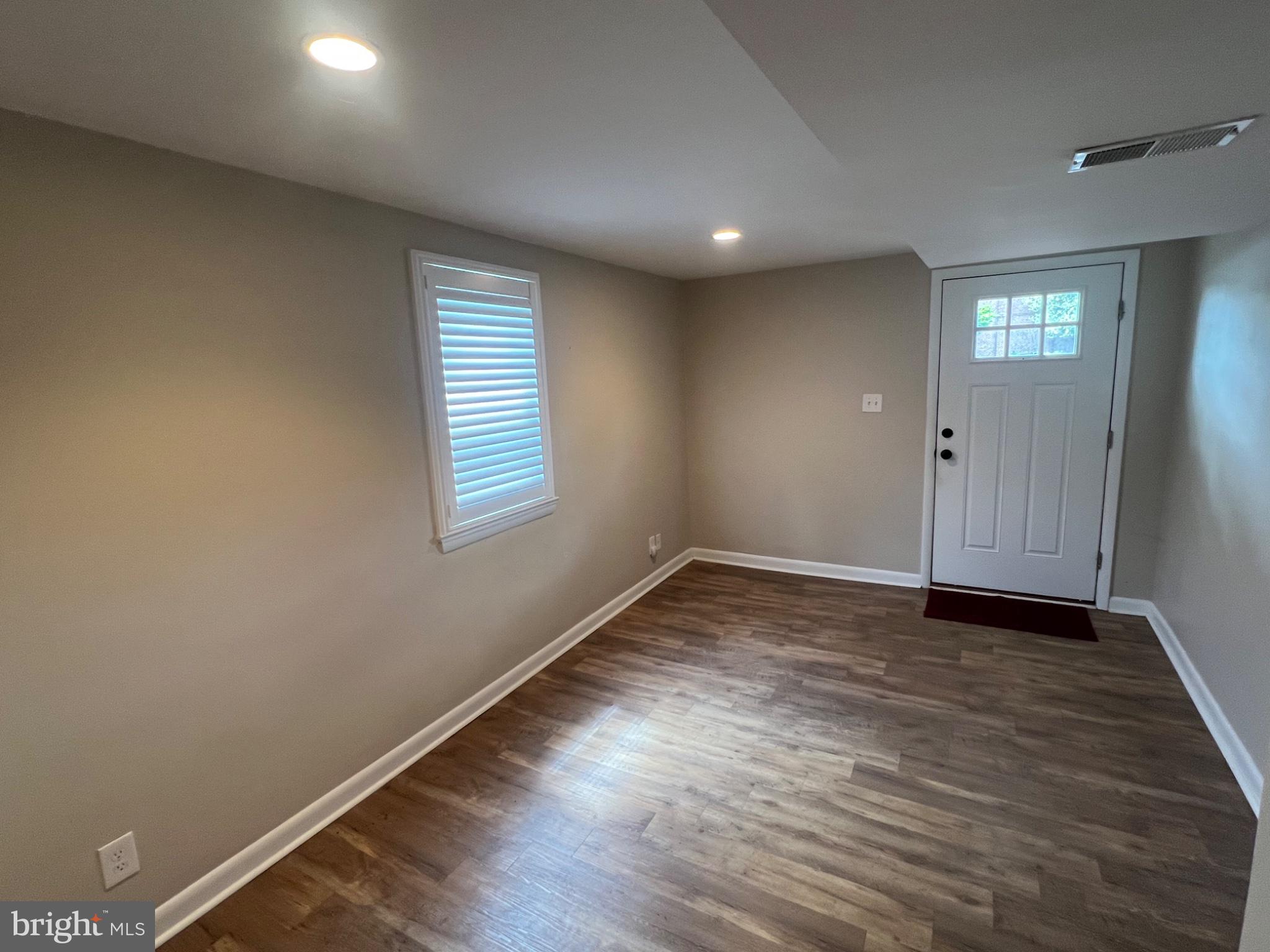 20 Fairview Road Swarthmore, PA 19081 - Photo 8 of 24 an empty room with wooden floor and windows