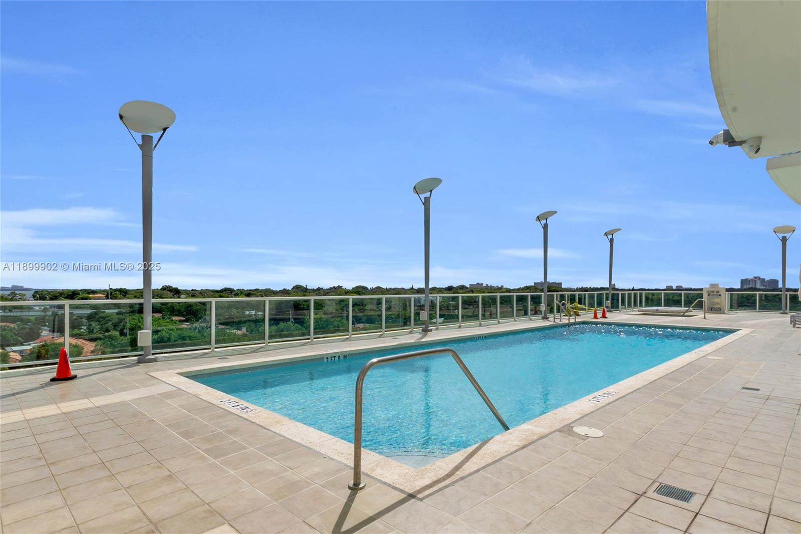 2525 Southwest 3rd Avenue, Unit 1002 Miami, FL 33129 - Photo 8 of 13 a view of a swimming pool and lounge chairs