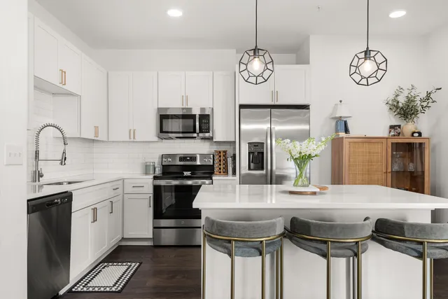 a kitchen with a counter space cabinets and stainless steel appliances