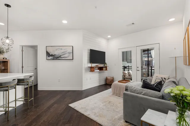 a living room with furniture and a flat screen tv