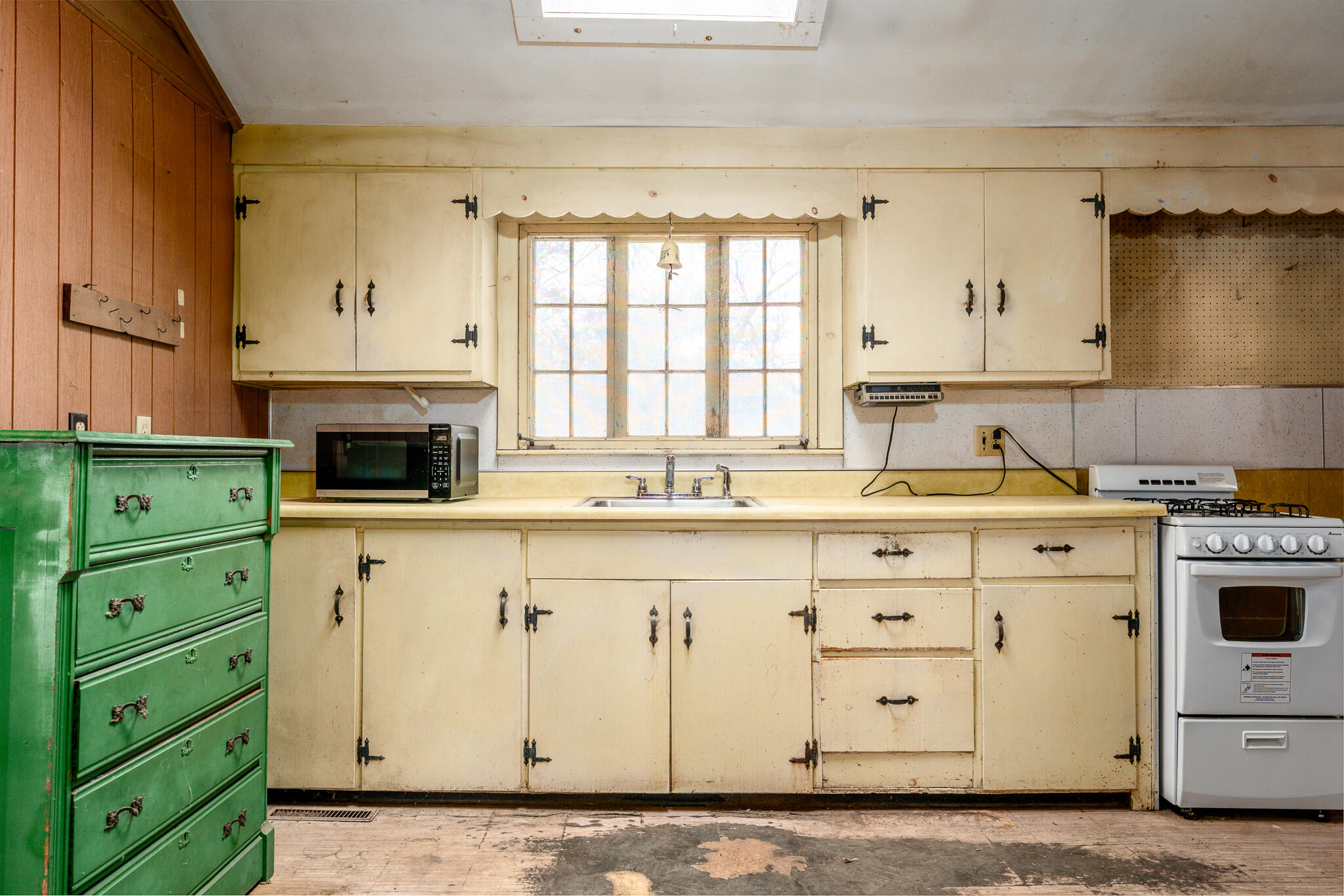 10 N Road West Dennis, MA 02670 - Photo 11 of 31 a kitchen with granite countertop a sink a stove and a window