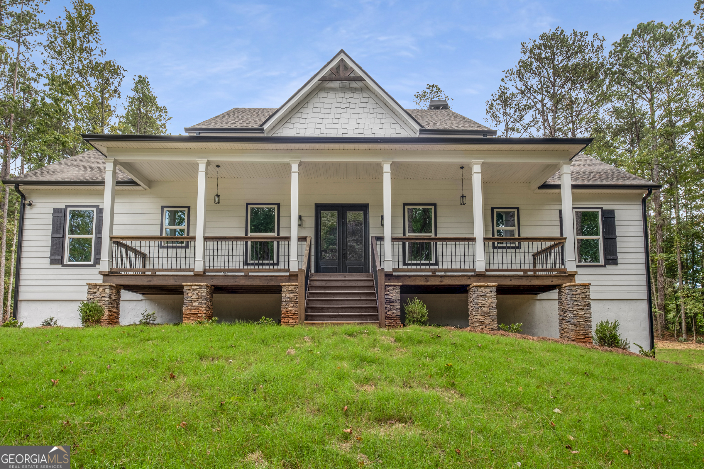 2035 Fischer Road Sharpsburg, GA 30277 - Photo 1 of 1 front view of house with a garden and swimming pool