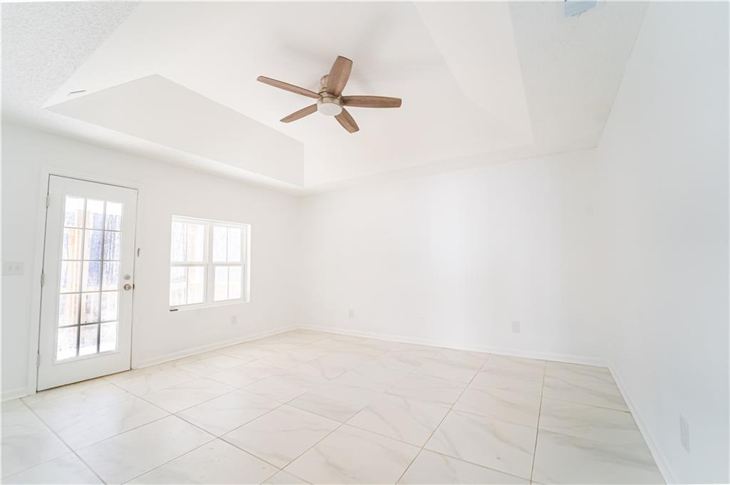 3479 Clare Cottage Trace Southwest Austell, GA 30106 - Photo 12 of 40 an empty room with windows and fan