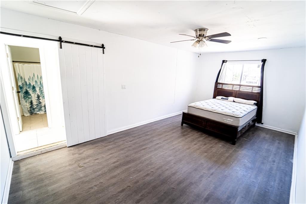 3479 Clare Cottage Trace Southwest Austell, GA 30106 - Photo 26 of 40 a bedroom with a bed and a window