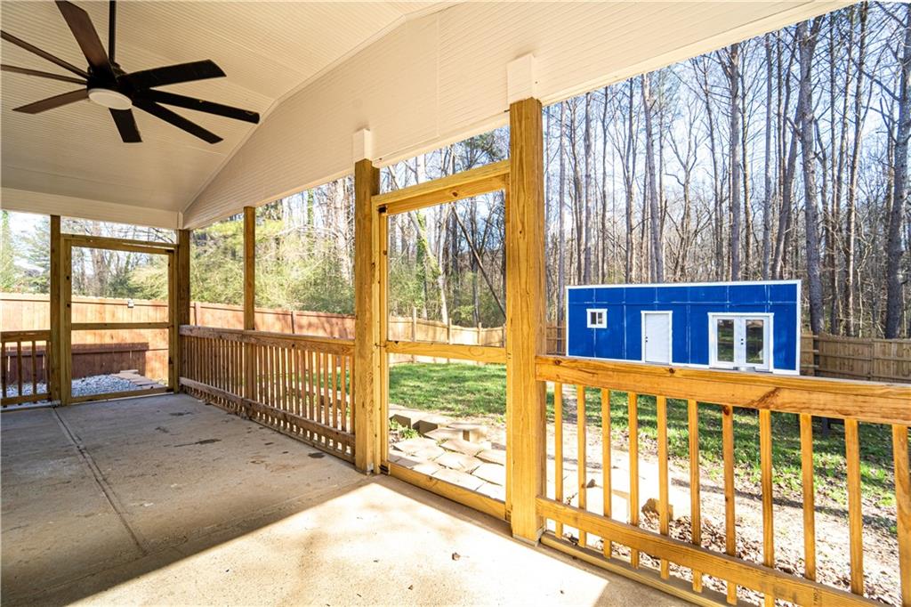 3479 Clare Cottage Trace Southwest Austell, GA 30106 - Photo 34 of 40 a view of a porch with a floor to ceiling window stairs and a balcony