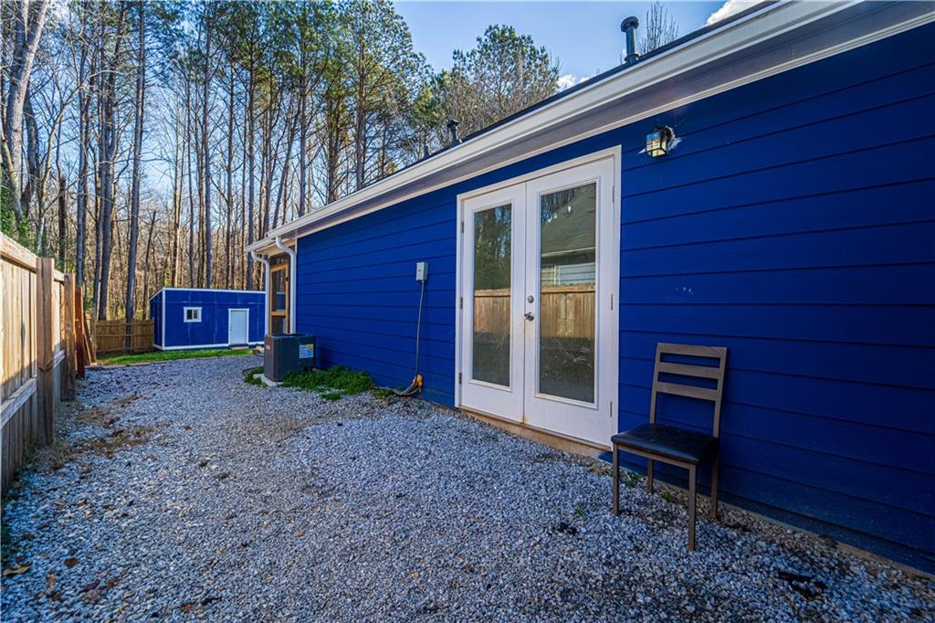 3479 Clare Cottage Trace Southwest Austell, GA 30106 - Photo 38 of 40 a view of a house with a yard and wooden fence