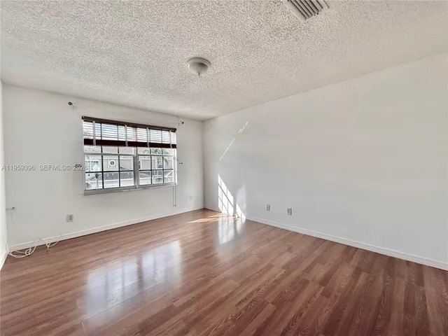 a view of a hallway with stairs