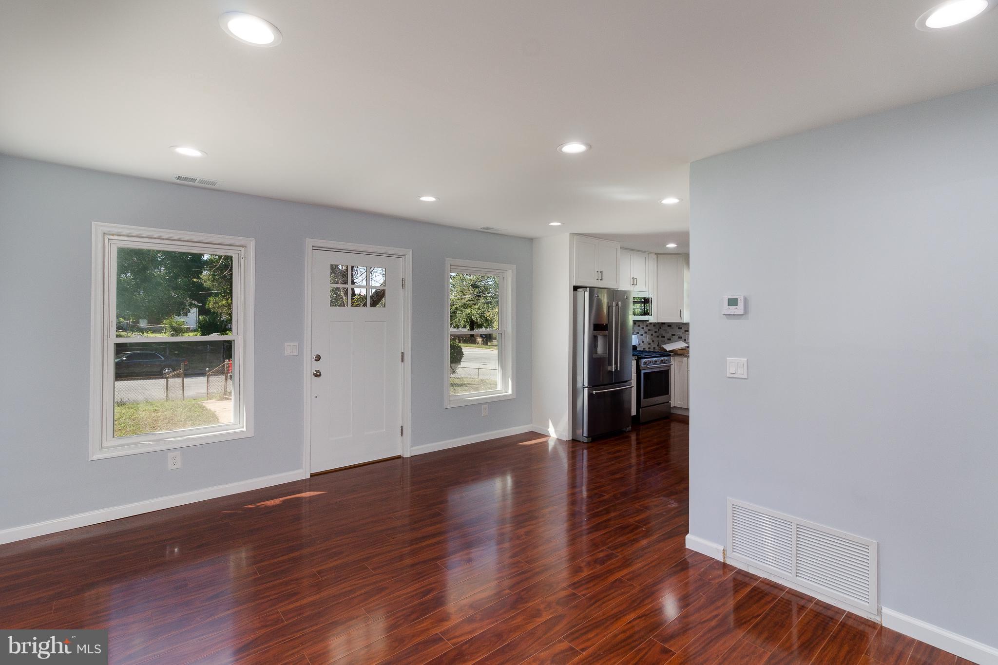 7700 Bender Road Landover, MD 20785 - Photo 5 of 13 an empty room with wooden floor and a window