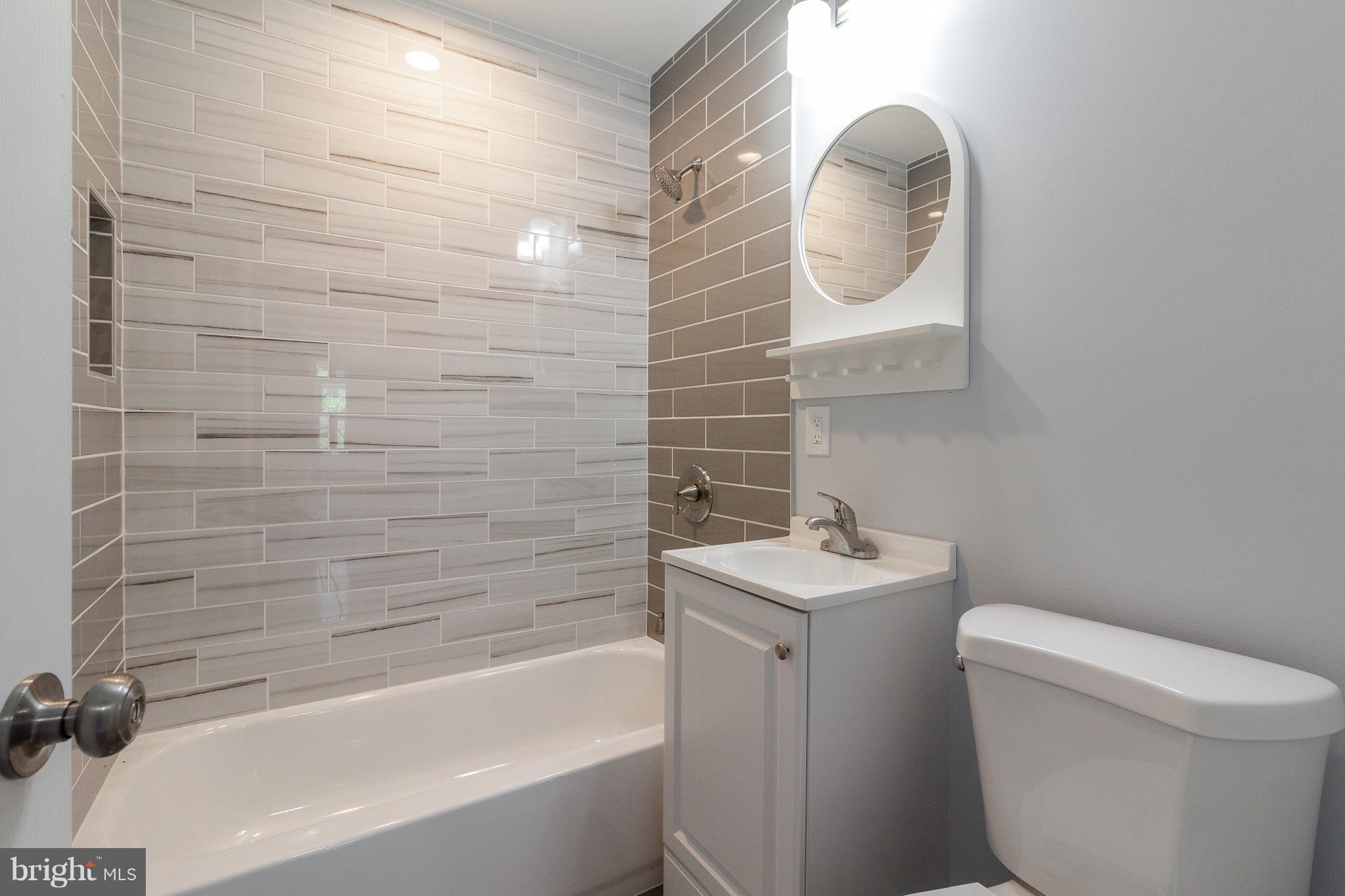 7700 Bender Road Landover, MD 20785 - Photo 7 of 13 a bathroom with a sink toilet and bathtub
