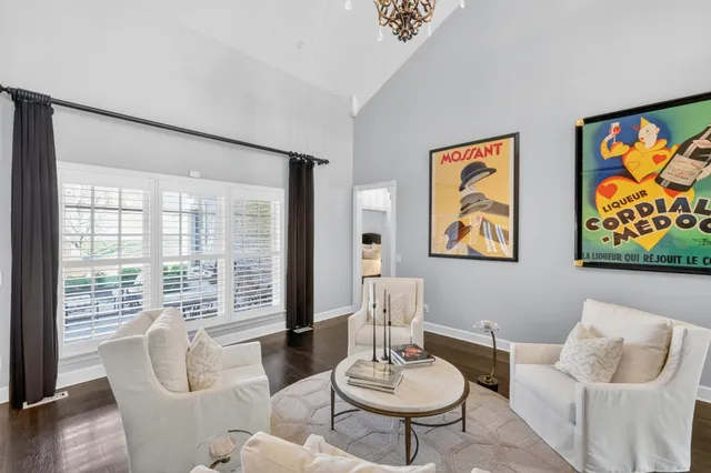 a living room with furniture and a ceiling fan
