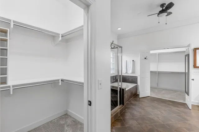 a kitchen with stainless steel appliances kitchen island granite countertop a refrigerator a stove and a sink