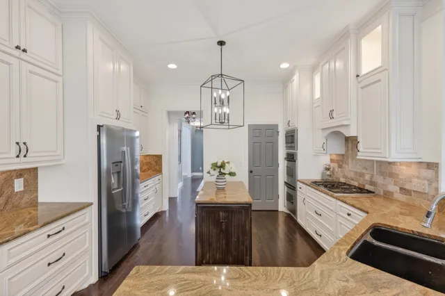 a living room with fireplace furniture and a flat screen tv