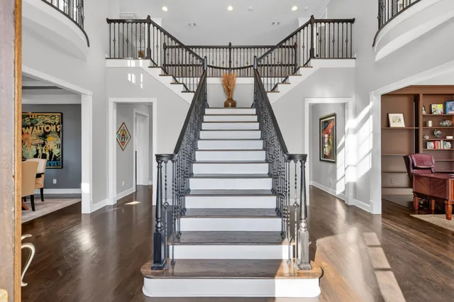 a view of entryway with wooden floor and stairs