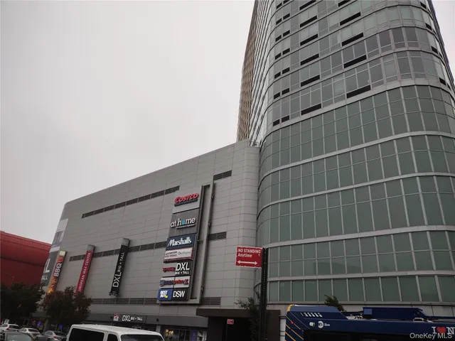 a view of city with the shops and trees