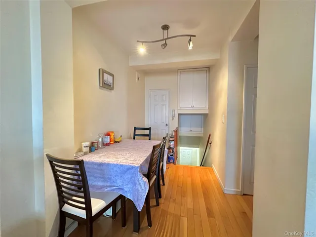 a view of a dining room with furniture and a chandelier