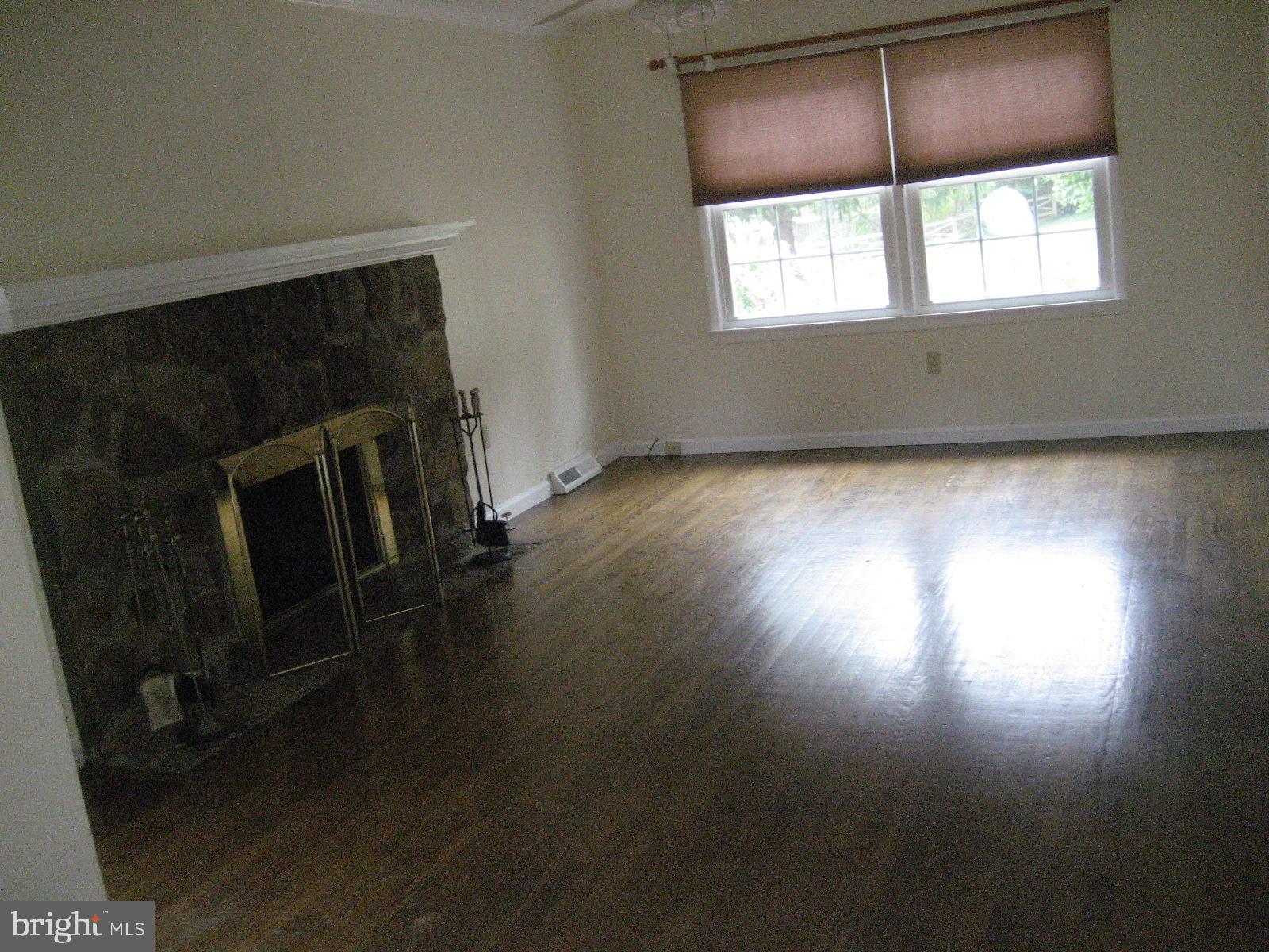 209 Dover Road Warrenton, VA 20186 - Photo 15 of 30 an empty room with wooden floor and windows