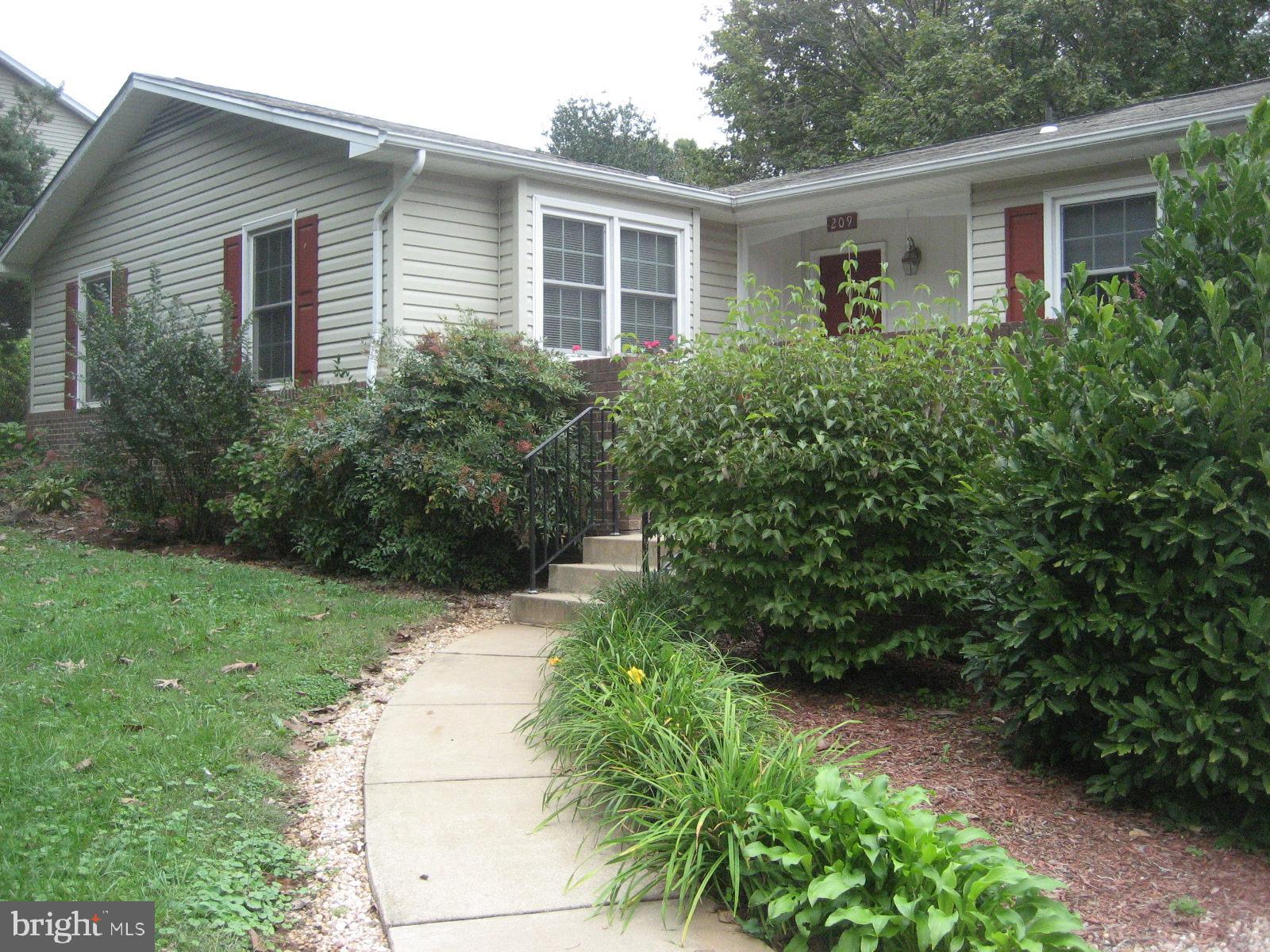 209 Dover Road Warrenton, VA 20186 - Photo 2 of 30 a front view of house with yard and green space