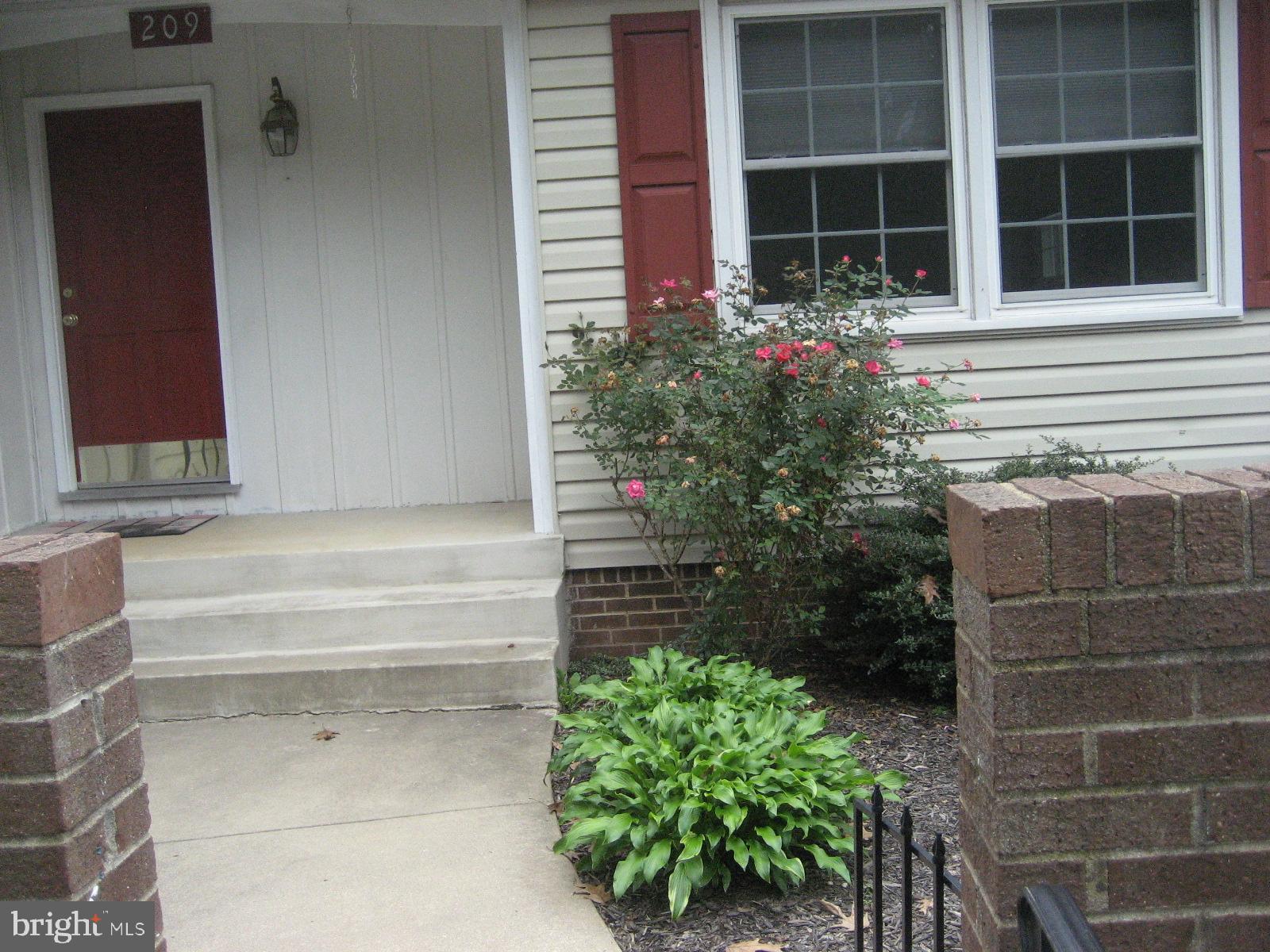 209 Dover Road Warrenton, VA 20186 - Photo 3 of 30 a front view of a house with a yard
