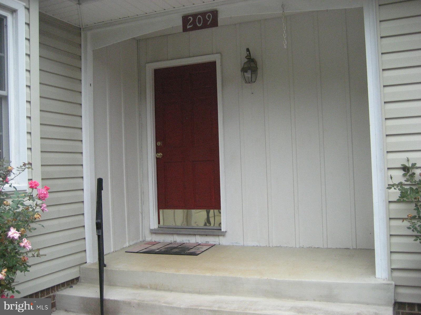209 Dover Road Warrenton, VA 20186 - Photo 4 of 30 a view of a door and a window
