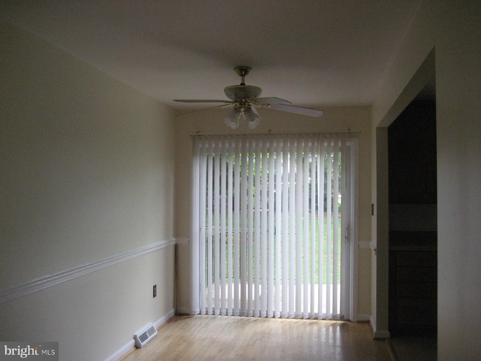 209 Dover Road Warrenton, VA 20186 - Photo 7 of 30 a view of a livingroom with a ceiling fan and window