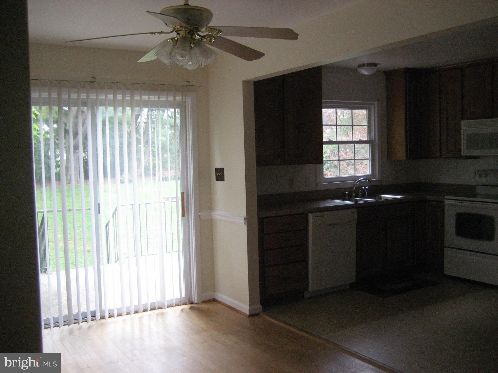 209 Dover Road Warrenton, VA 20186 - Photo 10 of 30 a kitchen with granite countertop a stove and a window