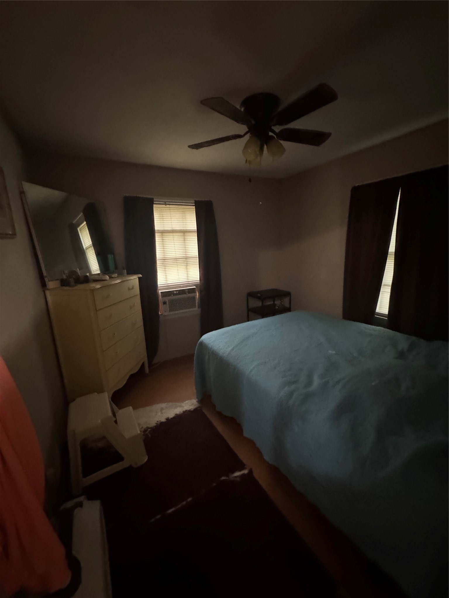 45 County Road 2859 Cleveland, TX 77327 - Photo 12 of 15 a bed sitting in a room next to a window