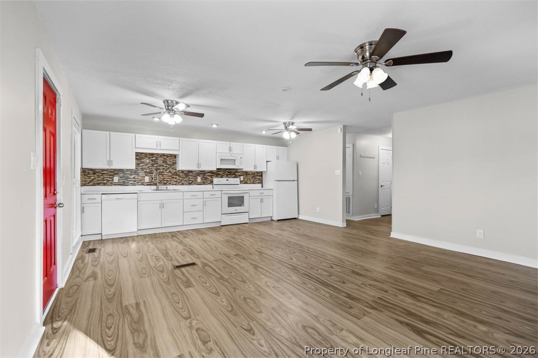 3305 Hunting Bay Drive Spring Lake, NC 28390 - Photo 10 of 27 a view of a kitchen with a sink and wooden floor