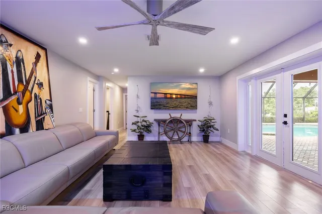 a living room with furniture and wooden floor