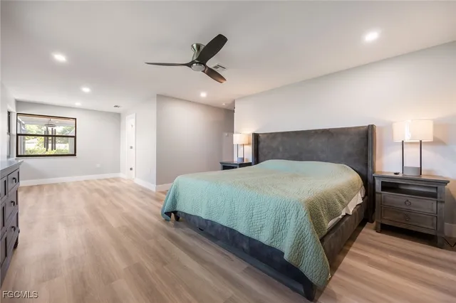 walk in closet with clothes and shoes