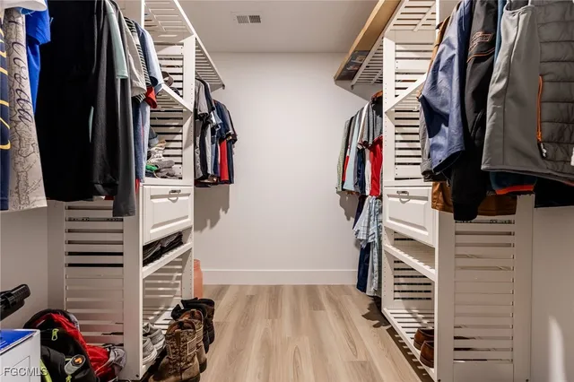 a bathroom with a sink double vanity and a mirror