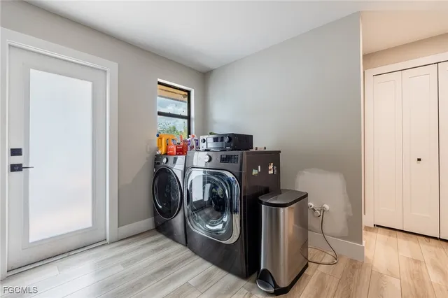 a view of a patio with a table chairs and a backyard