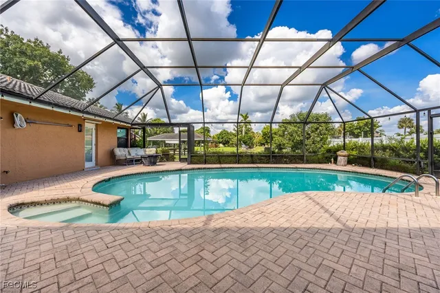 a view of a swimming pool with a patio