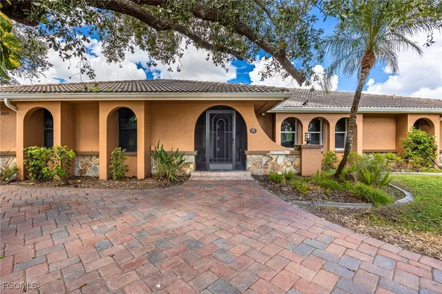 a front view of a house with garden