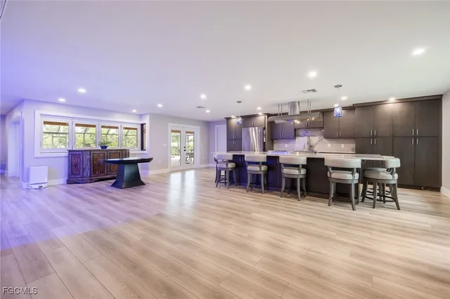 a kitchen with stainless steel appliances granite countertop a stove and a sink