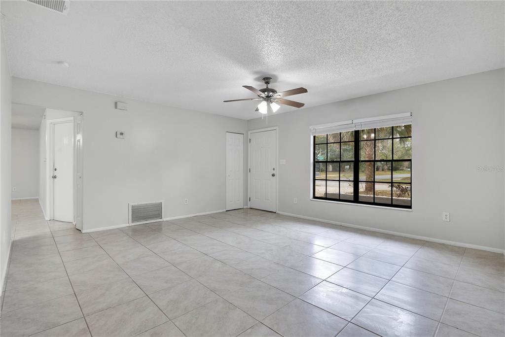 709 Sailfish Road Winter Springs, FL 32708 - Photo 5 of 28 a view of an empty room with a window