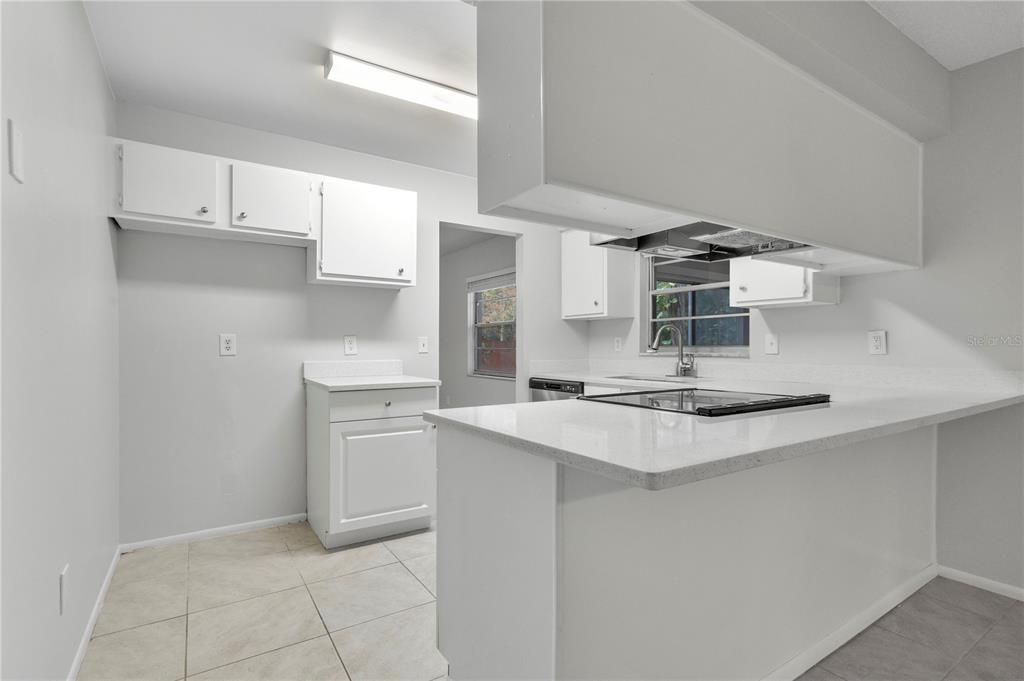 709 Sailfish Road Winter Springs, FL 32708 - Photo 7 of 28 a kitchen with stainless steel appliances a sink and cabinets