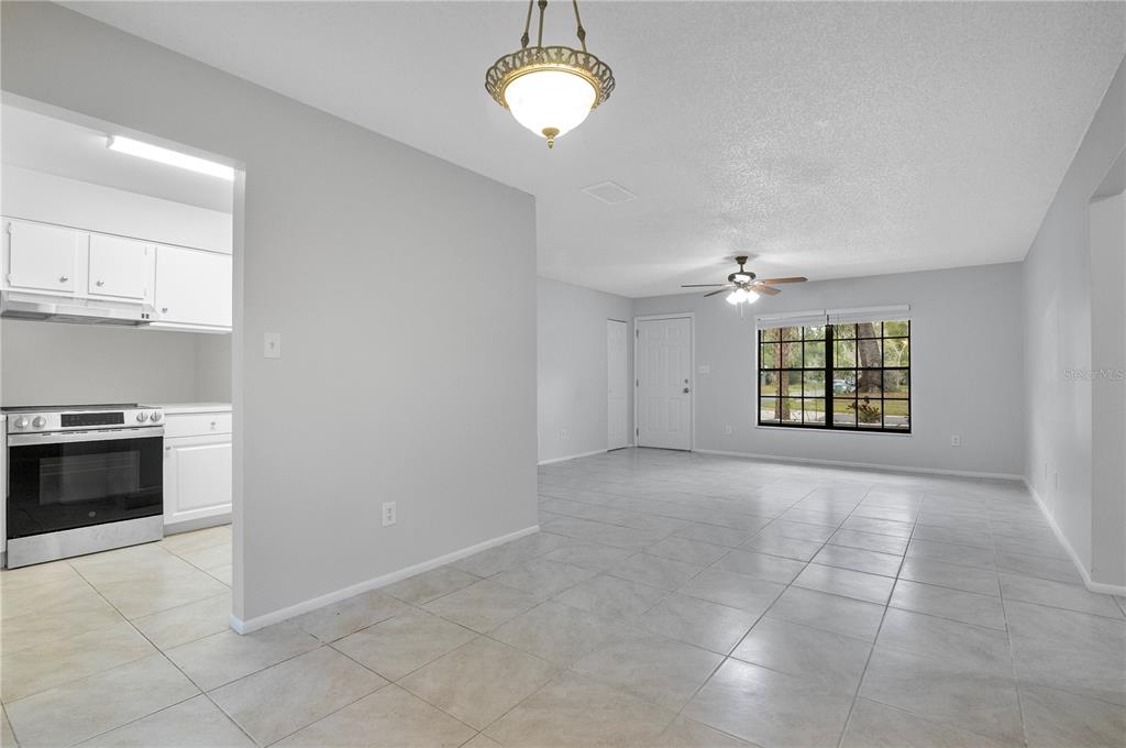 709 Sailfish Road Winter Springs, FL 32708 - Photo 10 of 28 a view of an empty room with a kitchen