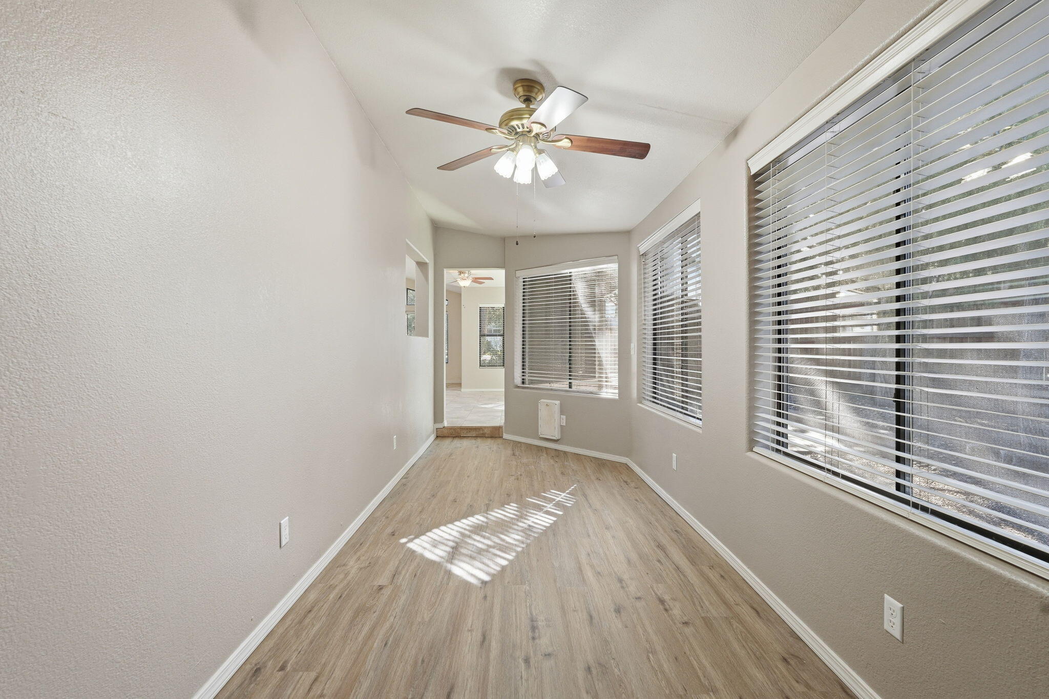 310 North Trailwood Road Payson, AZ 85541 - Photo 20 of 55 a view of an empty room with wooden floor and a window