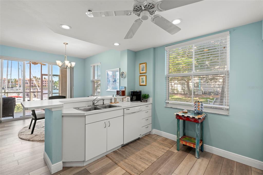 2060 Matecumbe Key Road, Unit 2106 Punta Gorda, FL 33955 - Photo 15 of 56 a kitchen that has a lot of cabinets a sink and appliances in it